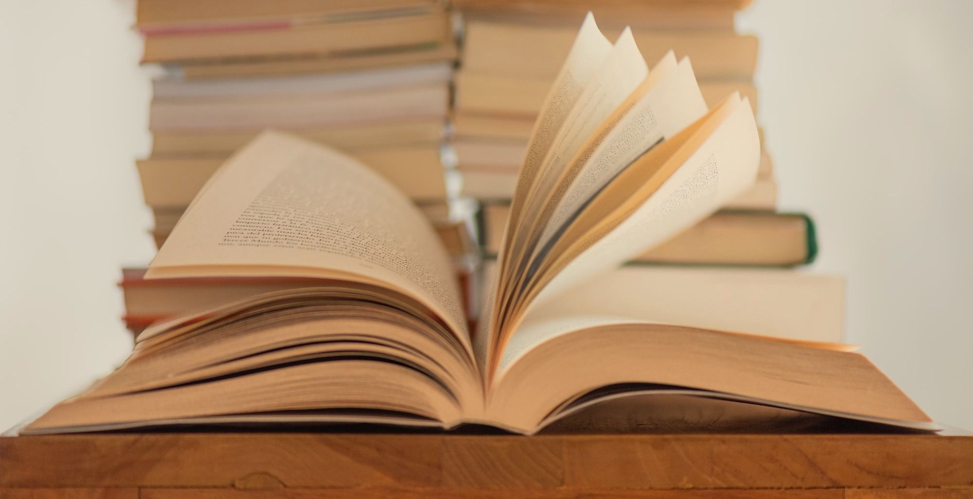 white book on brown wooden table